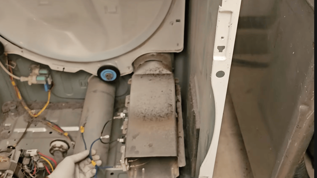 remove the bulkhead, release the belt, and lift out the drum