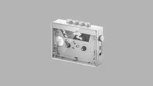 Silver FiiO CP13 cassette player with transparent front showing internal mechanism and side volume knob