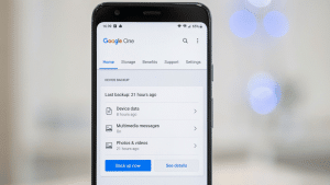 Google One app showing device backup details and stored data options on a phone.