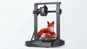 Creality Ender 3 V3 SE 3D printer with a printed orange fox model on the build plate.