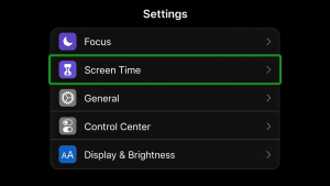 iPhone Settings menu with Screen Time option highlighted in green